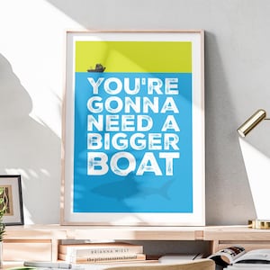 May include: A blue and yellow poster with the text "You're gonna need a bigger boat" in white. The text is surrounded by a silhouette of a shark.