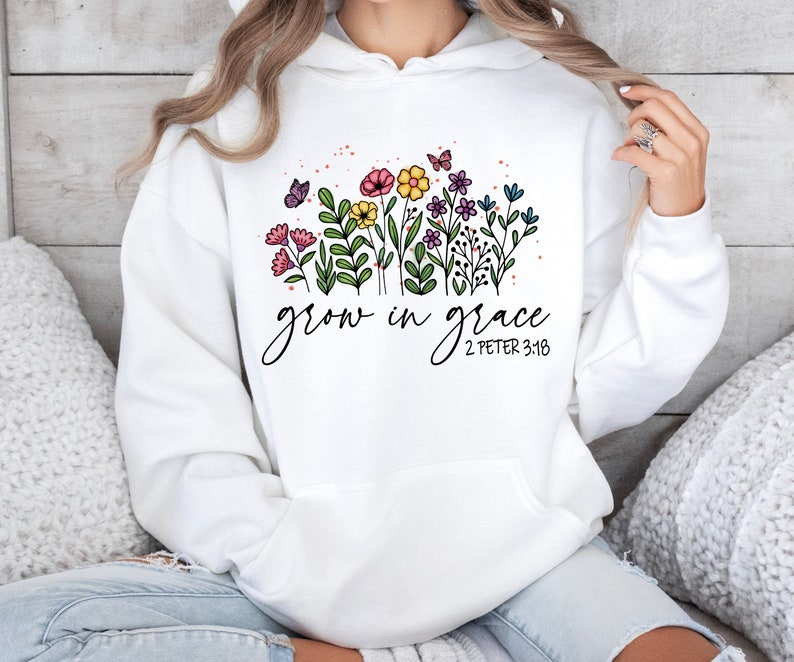 May include: White hoodie with a floral design and the text "grow in grace 2 Peter 3:18".