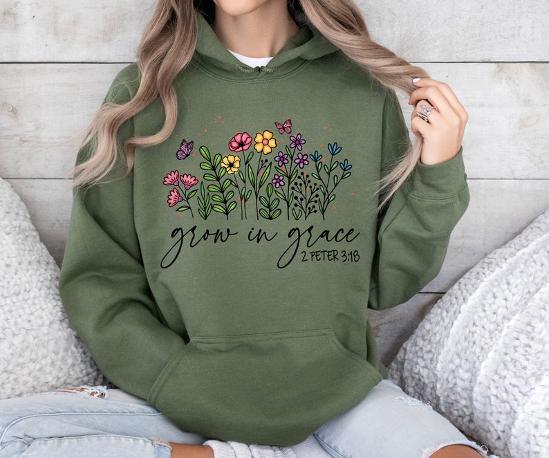 May include: Green hooded sweatshirt with a floral design and the text "grow in grace 2 Peter 3:18"