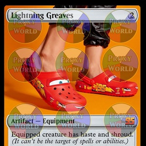 May include: A red and yellow Lightning McQueen themed pair of Crocs with a Magic: The Gathering card overlay. The card is titled "Lightning Greaves" and is an artifact - equipment. The card text reads "Equipped creature has haste and shroud. (It can't be the target of spells or abilities.) Equip 0. Ka-CHOW!"