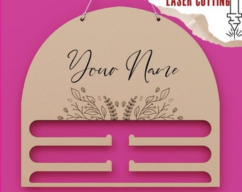 May include: A beige laser-cut sign with the text "Your Name" in cursive, floral design, and three horizontal slots. The sign includes the text "DIGITAL FILE FOR LASER CUTTING" and file type options: DXF, SVG, AI, PDF, CDR.