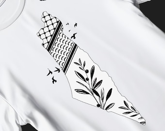 Könnte beinhalten: Weißes T-Shirt mit einer schwarz-weißen Grafik einer Karte mit traditionellen Mustern und Olivenzweigen. Das Design beinhaltet fliegende Vögel und den Text "PNG, SVG, PDF" und "Geeignet für dunkle und helle Farben".