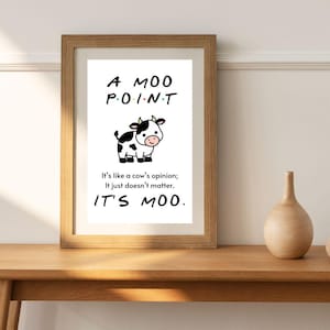 Peut inclure: Une impression encadrée blanche avec une vache de dessin animé noir et blanc et le texte "A MOO POINT. It's like a cow's opinion; It just doesn't matter. IT'S MOO."