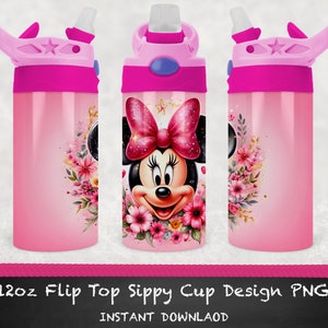 Puede incluir: Taza de vaso con tapa abatible rosa de 350 ml con un dise&ntilde;o de Minnie Mouse. La taza presenta un dise&ntilde;o floral rosa y blanco con una cara de Minnie Mouse en el centro. La taza tiene una tapa rosa con una pajita azul.