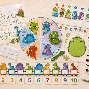 Puede incluir: Un conjunto de actividades educativas con temática de dinosaurios que incluye una ruleta, un tablero numérico en forma de tren del 1 al 10, un tablero de expresiones faciales y un tablero de juego de recorrido con figuras y puntos adhesivos.