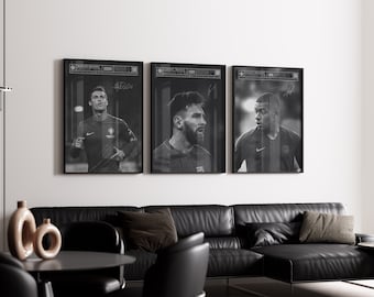 May include: Three black and white framed posters of famous soccer players. The posters are hanging on a white wall above a black leather couch.