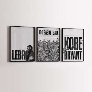 May include: Three framed black and white basketball-themed posters. The left poster features the name "LEBRO" with a portrait of a basketball player. The center poster reads "100 BASKETBALL" with a crowd image. The right poster says "KOBE BRYANT".