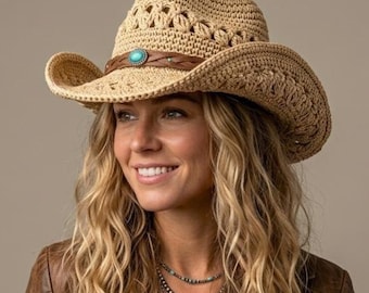 May include: A beige crocheted cowboy hat featuring a brown braided band with a central turquoise stone accent. The hat has a structured crown and a curved brim, providing a textured appearance. The design includes intricate woven patterns throughout.