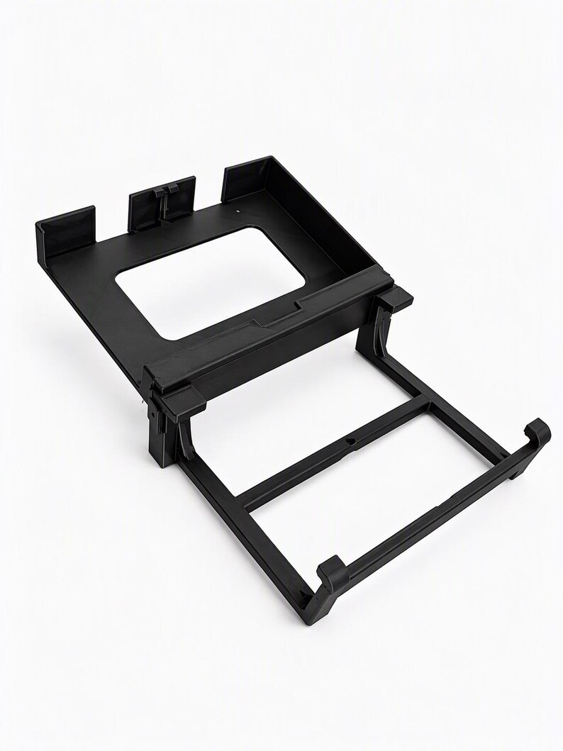 Monitor holder and clamp frame seen from above, with the hooks that click around the bottom edge of the controller