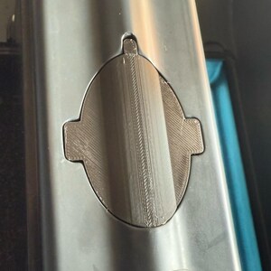 Sonar cover with side tabs fitted in the hull cutout, straight view from above