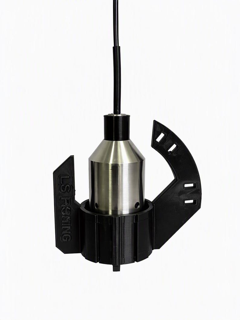 Carplounge Winchcam camera hanging straight down on its cable inside the black anti-spinner, fins and cable clip arm visible