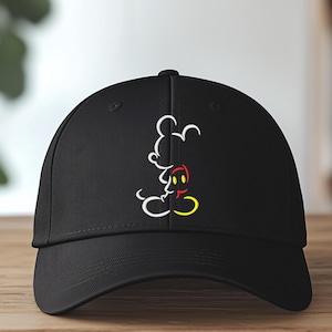 May include: Black baseball cap with a white outline of Mickey Mouse's head and a red and yellow outline of his ears.