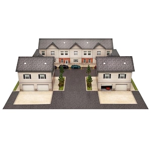 May include: A scale model of a multi-unit residential complex featuring two forward-facing buildings with garages and a central connecting structure. The buildings have light-coloured siding, dark shingled roofs, and small green trees.