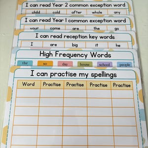May include: A set of educational flashcards for children, with titles including "Numbers to 100" and "I can practise my spellings." The cards have colourful borders and include text for learning, such as common exception words.