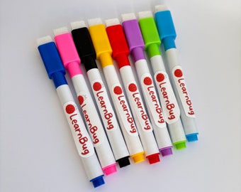 May include: A collection of eight colorful dry-erase markers with attached erasers. The markers are white with colored caps and tips in blue, pink, black, yellow, red, purple, green, and light blue. Each marker has the text "LearnBug" printed on it.