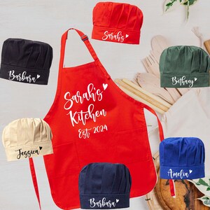 a red apron with personalized names on it