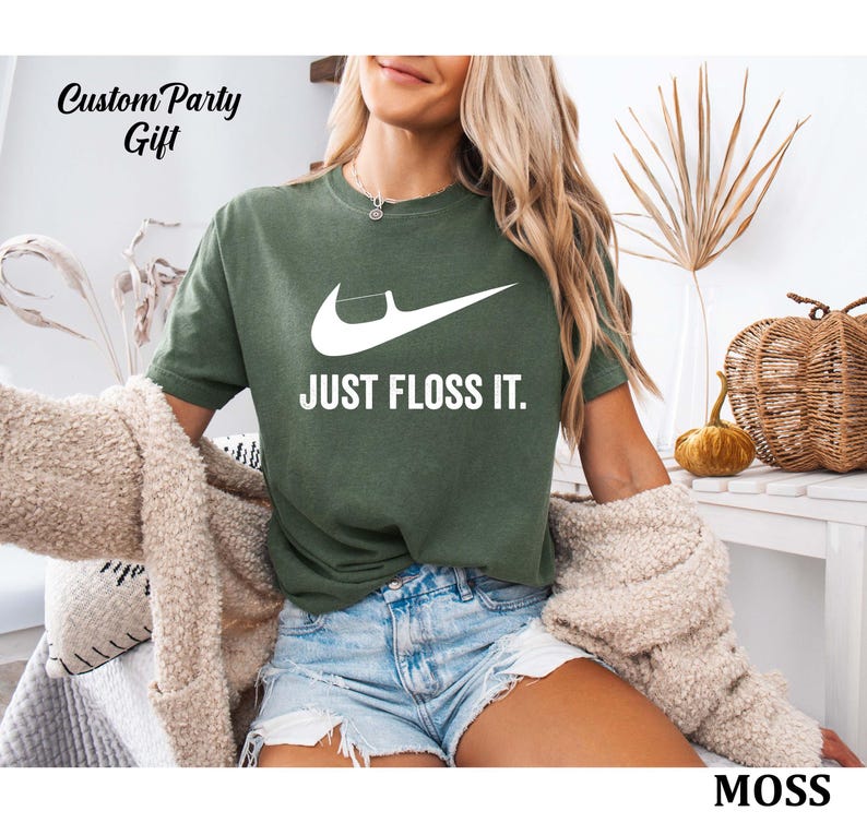 a woman in a green shirt that says just floss it