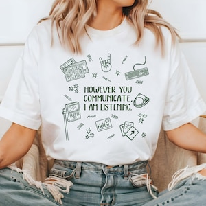 A person wearing a white t-shirt with a graphic design and text printed on it.