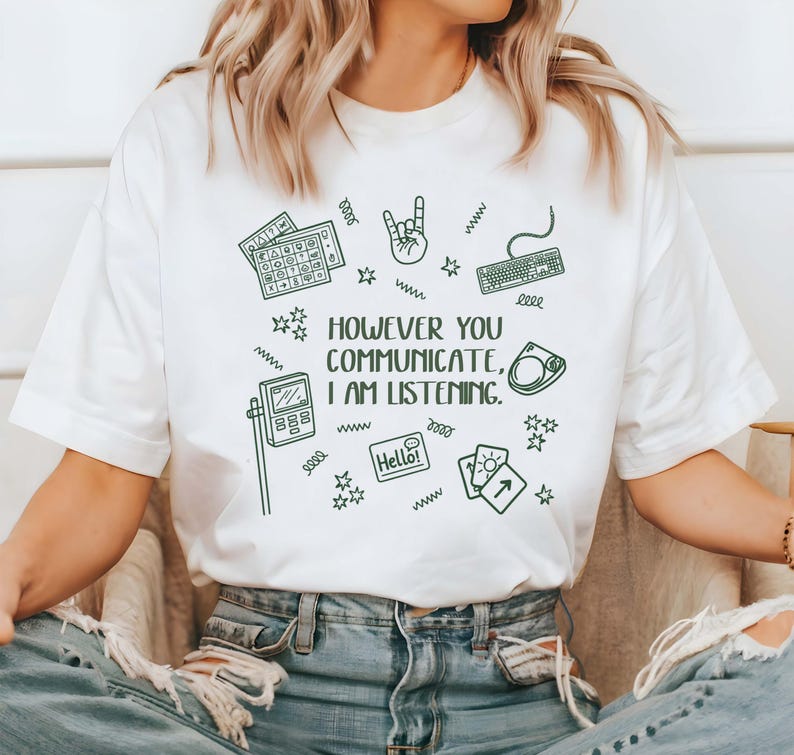 A person wearing a white t-shirt with a graphic design and text printed on it.