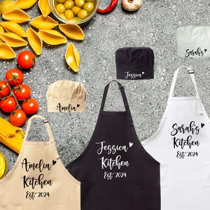 a group of personalized aprons sitting on top of a counter