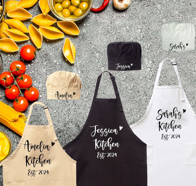a group of personalized aprons sitting on top of a counter