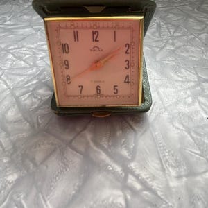 Horloge de voyage solaire vintage fabriquée en Suisse, non testée