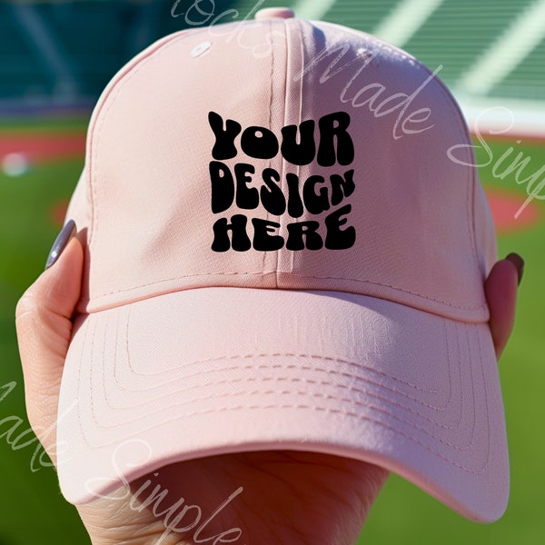 Mockup Cap Mockup Light Pink baseball Hat Mockup Hand Holding Female Baseball Hat Mockup With Baseball Field Background For Print On Demand