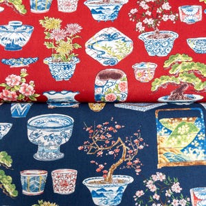 May include: Red and blue fabric with a repeating pattern of bonsai trees, flowers, and pots. The fabric is perfect for quilting, crafts, and home decor.