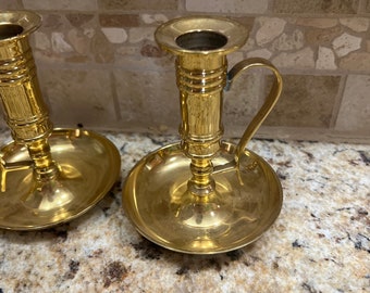 pair of vintage mid century brass candlestick holders with handle