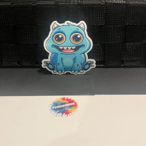 Happy Blue Monster - autocollant en vinyle - ordinateur portable - gourde - étui pour téléphone - cahiers