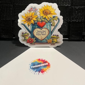 Commencez votre journée avec un sourire - Grenouilles avec tournesols dans un arrosoir - Sticker en vinyle - Ordinateur portable - Bouteille d'eau - Étui pour téléphone - Cahiers