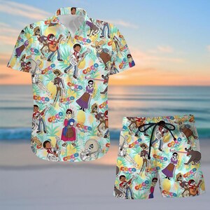 May include: A matching short-sleeve button-down shirt and shorts set. The light blue set features a repeating pattern of cartoon characters, musical instruments, and the word "COCO". The shorts have a drawstring waist.