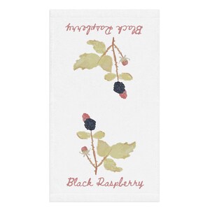 May include: White hand towel with a watercolor design of black raspberry branches. The branches have yellow-green leaves, red and black berries, and the text "Black Raspberry" in a cursive font.