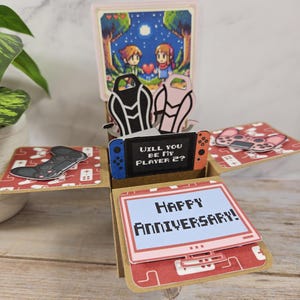 Tarjeta de felicitación hecha a mano en 3D con motivo de feliz aniversario o día de San Valentín para pareja de jugadores