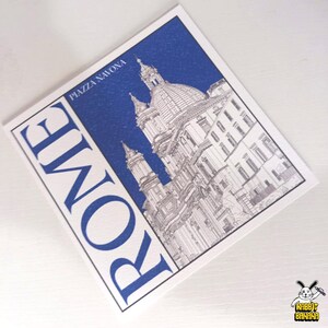 May include: A white and blue postcard featuring a detailed illustration of a building in Rome, Italy. The word "ROME" is printed vertically in blue on the left side, with "PIAZZA NAVONA" at the top. The image includes a small cartoon rabbit logo.