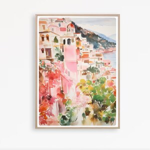 May include: Watercolor painting of a colorful Italian village with pink buildings, green trees, and a blue sea in the background.