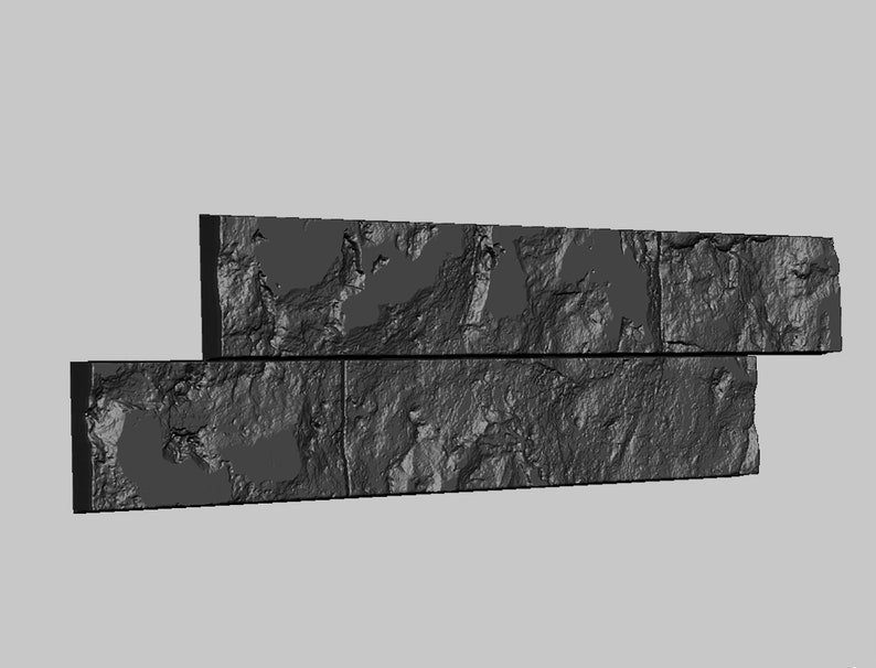 May include: Three rectangular stone tiles stacked on top of each other. The tiles are a dark gray color and have a rough, textured surface.