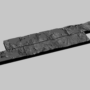 May include: A set of five gray stone tiles arranged in a rectangular shape. The tiles are textured and have a rough surface.