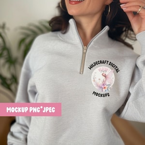 May include: Gray sweatshirt with a zipper and a round logo that says "Wildcraft Digital" with a fairy graphic inside. The logo is on the left side of the sweatshirt.