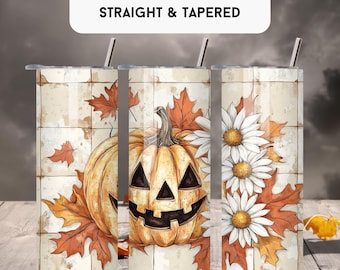 May include: 20 oz tumbler wrap with a Halloween theme. The design features a smiling jack-o'-lantern, fall leaves, and white daisies. The tumbler has a stainless steel straw and a lid. The background has a vintage, rustic look.