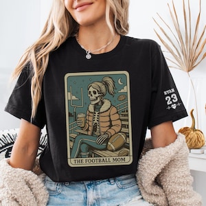 Custom Football Mom Shirt With Skeleton Design, Personalized Sleeve Name And Number Jersey Tee, Game Day Gift For Sports Mama Or Team Mom