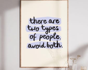 May include: A rectangular wall art print in a wooden frame featuring a cream background with four horizontal light purple brushstroke shapes. The black handwritten text reads: there are two types of people. avoid both.