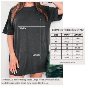 May include: Dark gray Comfort Colors C1717 t-shirt. The image includes a size chart with measurements in inches, ranging from S to 4XL. The width measurements range from 18.25 to 29.75 inches, and the length measurements range from 26.6 to 33.5 inches.