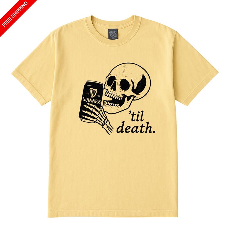 May include: Yellow t-shirt featuring a black graphic of a skull holding a Guinness can, with the text "'til death." The shirt has a crew neck and short sleeves. The graphic is on the front of the shirt.