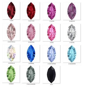 Può includere: Una tabella che mostra 12 colori diversi di strass a forma di marquise. I colori sono Siam, Siam chiaro, Fucsia, Ametista, Rosa chiaro, Rosa, Cristallo, Cristallo AB, Zaffiro, Zaffiro chiaro, Acquamarina, Peridoto, Diamante nero e Jet.