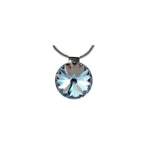 May include: A round, faceted pendant necklace with a silver chain. The pendant is a brilliant blue and clear crystal, reflecting light. The necklace is a piece of jewellery.