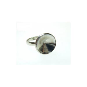 May include: A silver-toned adjustable ring with a large, circular, recessed setting. The setting has a textured, concentric design. The ring is set against a white background.