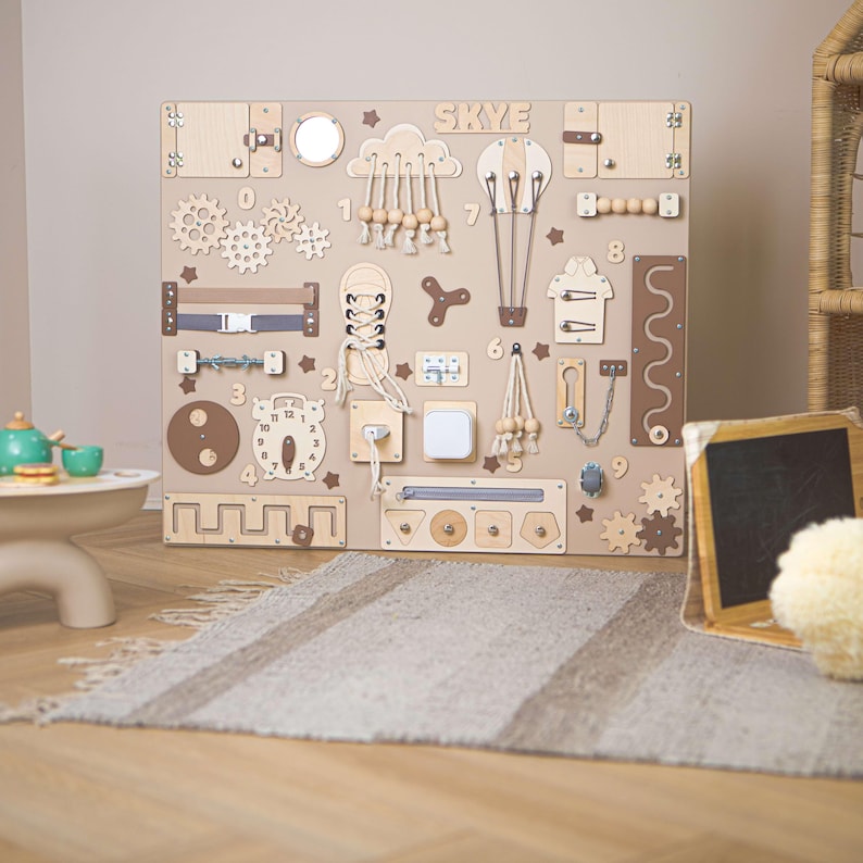 Montessori wall in natural neutral colours with various components for attention exercises.