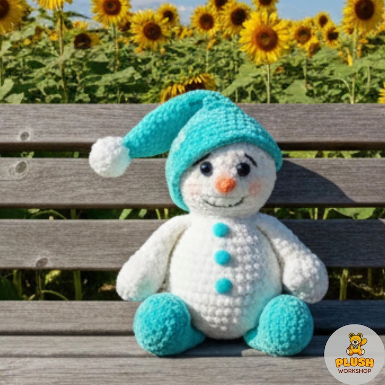 Blue hat snowman amigurumi crochet pattern tutorial PDF, DIY no sew stuffed plush snowman toy, easy cute beginner friendly crochet animal project, handmade snuggler buddy cartoon snowman, winter themed crochet ornament, digital step by step amigurumi pattern, nursery decor crochet toy, home decor plush snowman gift