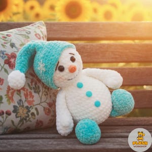Handmade snowman amigurumi crochet pattern PDF, blue hat winter snowman plush toy, DIY no sew easy beginner crochet animal, cute cartoon snuggler buddy, crochet snowman ornament toy, digital step by step amigurumi tutorial, nursery decor winter plush, home decor crochet snowman, gift for beginner amigurumi crocheter